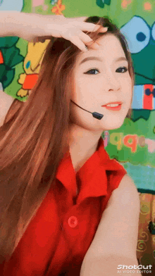 a woman wearing a red shirt and a microphone with shotcut ai video editor written on the bottom