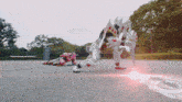 a robot with a red light coming out of it 's hand