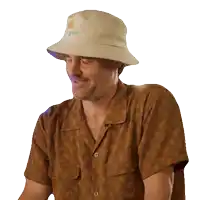 a man wearing a bucket hat that says blue