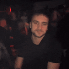 a man is sticking his tongue out in a red light