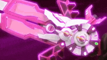 a pink and white robot with a purple background is being held in someone 's hand .