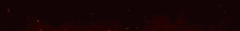 a red light beam is coming out of a dark room .