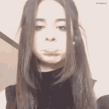 a woman with long hair is making a funny face with a gifcamlas watermark