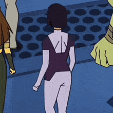 a woman in a purple shirt has the letter v on the back