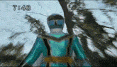a person in a blue superhero costume is standing in front of trees and the time is 7:46