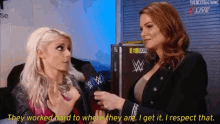 two women are talking to each other and one of them says they worked hard to get where they are