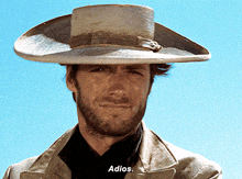 a man in a cowboy hat says adios