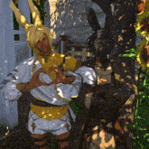 a man and a woman are making a heart with their hands
