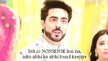 a man with a beard is standing next to a woman and says yeh jo nonsense hai na