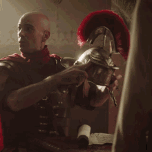 a bald man in a red cape and armor