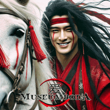 a man with long black hair is standing next to a white horse with museumbola written on it