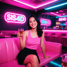 a woman sitting on a pink couch holding a glass in front of a sign that says sis4d