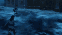 two people are fighting in the water and one is holding a long blue sword