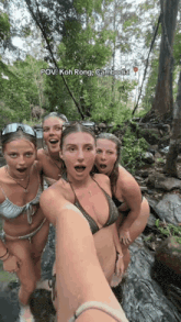 a group of women in bikinis are standing in a stream with the caption pov koh rong cambodia on the bottom