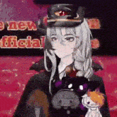 a girl in a hat is standing in front of a sign that says a new official
