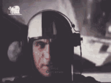 a man wearing a helmet and headphones says " inise geciyorum "