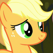 a close up of a pony 's face with green eyes