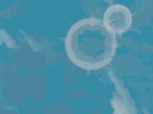 a close up of a blue background with a few bubbles in it .