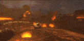 a person 's fist is visible in front of a large fire