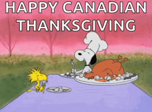 a cartoon of snoopy and woodstock sitting at a table with a plate of food and the words happy canadian thanksgiving