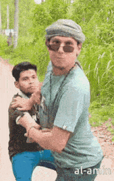 a man wearing sunglasses and a turban is holding another man
