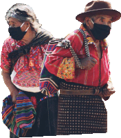 a man and a woman wearing face masks are standing together