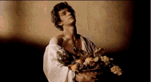 caravaggio boy with a basket of fruit posing art model andrew garfield