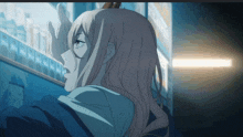 a girl with long blonde hair is looking at something