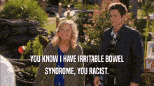 a man and a woman standing next to each other with a caption that says you know i have irritable bowel