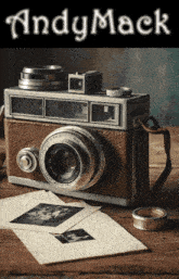 an old camera sits on a wooden table with andy mack written on the top