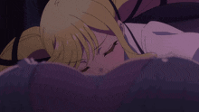 a girl with blonde hair is laying on a purple surface