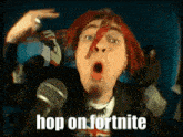 a man with red hair is singing into a microphone and the words hop on fortnite are on the screen behind him