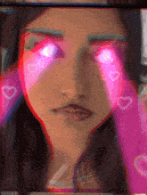 a close up of a woman 's face with pink hearts coming out of her eyes