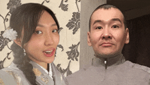 a man and a woman standing next to each other