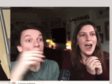 a man and a woman are sitting in front of a screen that says " connection established "