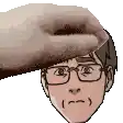 a hand is holding a man 's head with glasses on it .