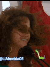 a close up of a woman 's face with the hashtag lialmeida05 on the bottom right