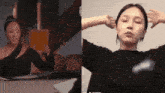 a woman in a black shirt is sitting at a table with her arms outstretched ..