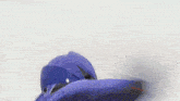 a person in a blue suit is standing on a white surface