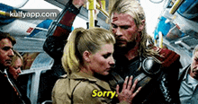 a man and a woman on a bus with the woman saying sorry