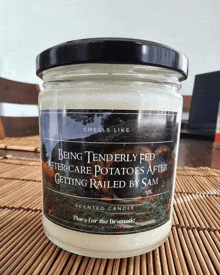 a jar of scented candle that says being tenderly fed after care potatoes after getting railed by sam