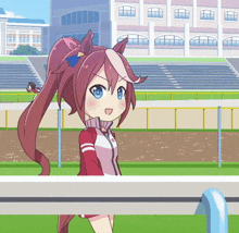 a girl with a ponytail is standing on a fence