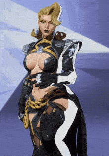 a woman in a black and white outfit is holding her waist