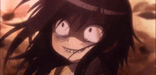 a close up of a girl making a funny face with her eyes closed .