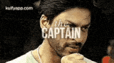 a close up of a man 's face with the words `` the captain '' written above him .