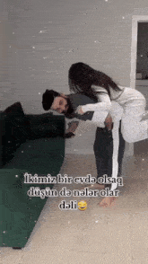 a man is carrying a woman on his shoulders with a caption that says ikimiz bir evde olsaq