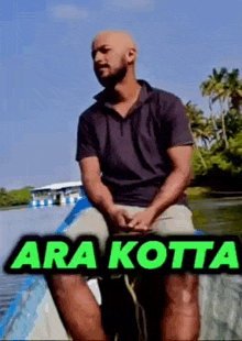 a man is sitting on a boat with the words ara kotta written on the bottom