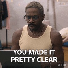 a man sitting in front of a laptop with the words you made it pretty clear