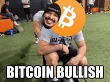 a man wearing a hat that says multiverse is sitting on someone 's shoulders