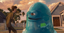 a cartoon character with one eye is standing next to a man